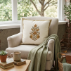 Minimalist cushion cover with elegant floral buta motif in warm earthy tones, perfect for adding a refined touch to home décor.